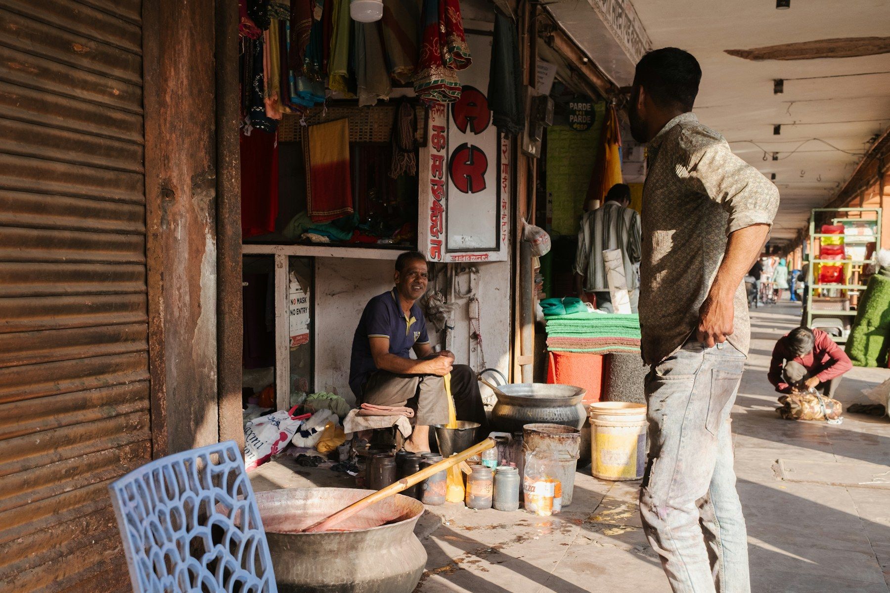Small businesses at work along a busy Indian street